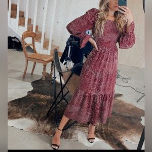 Brand new, fully lined, back button, sided zipper,color is closer to burgundy.